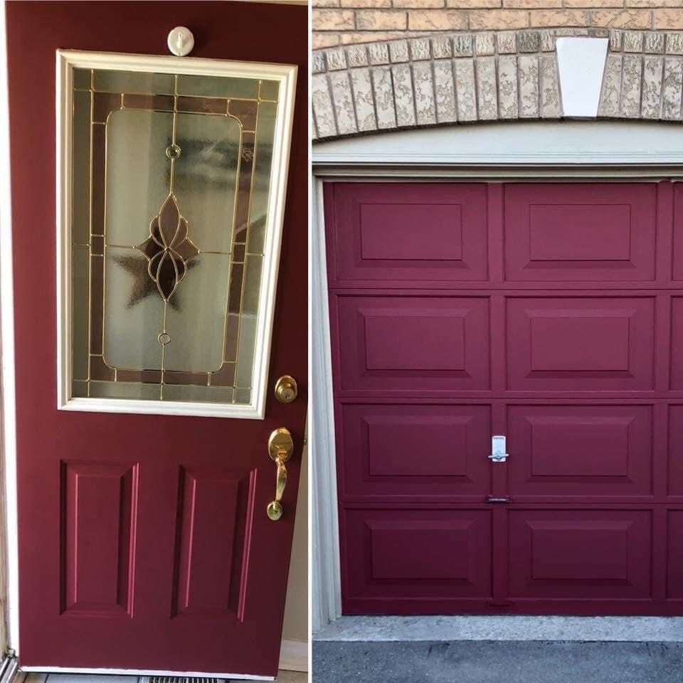 Front door and garage door freshly painted in deep red